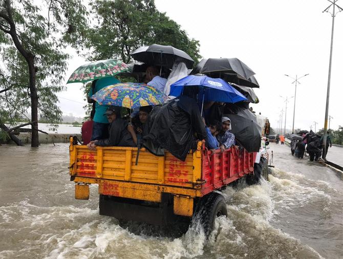 In the picture, a vehicle struggles through the flooded street of Vasai
(Picture courtesy/Samiullah Khan)