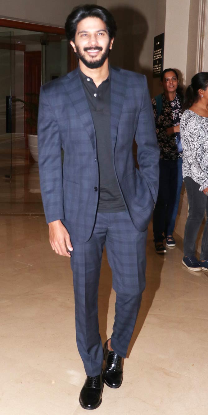 The Malayalam superstar looked dashing in a navy blue checked suit that he paired with sleek black shoes. 