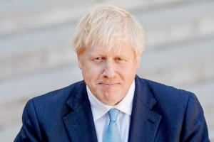 UK government loses majority as MP defects over Brexit