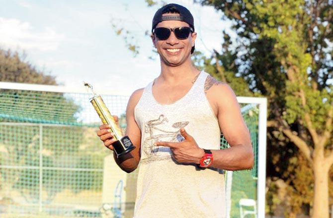Former India hockey goalkeeper Adrian D-Souza with his trophy