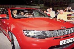 Spotted! MS Dhoni goes out for a drive in his new red SUV in Ranchi