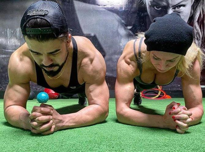 Charlotte Flair and Andrade often workout together and post videos of it online