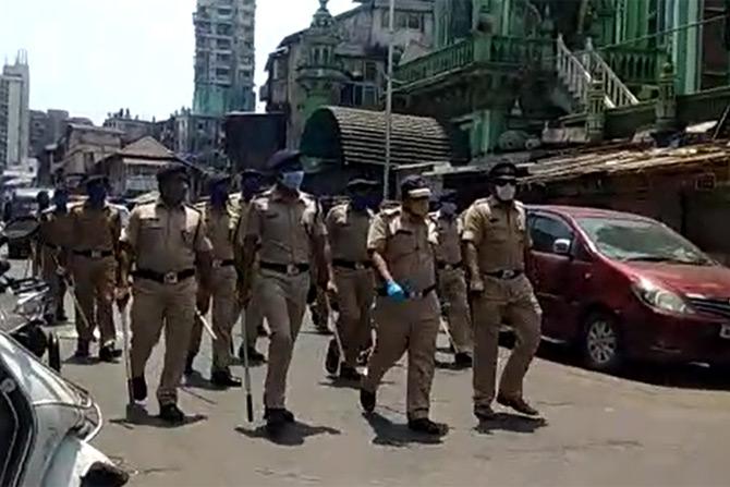 In photo: Mumbai police personnel patrol at Moulana Azad Road in Nagpada, South Mumbai.