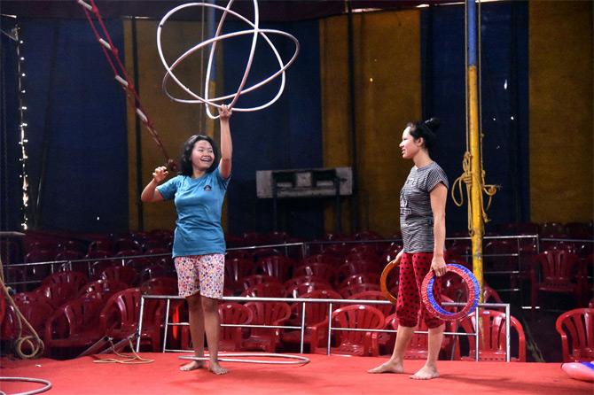 In photo: A gymnast from the Rambo Circus groups practices in the tent. 