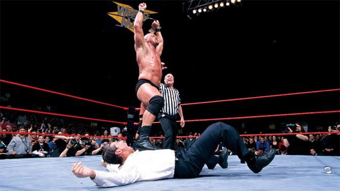 The Texas Rattlesnake 'Stone Cold' Steve Austin stands tall after he defeated The Rock for the WWE title at WrestleMania XV. The first of the classic three