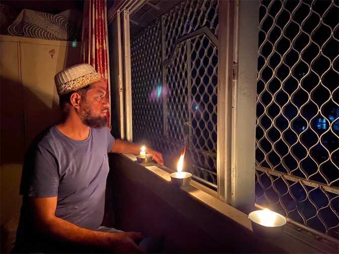 People lit candles, diyas and flashed lights of their mobile phones by standing in balconies of their houses.