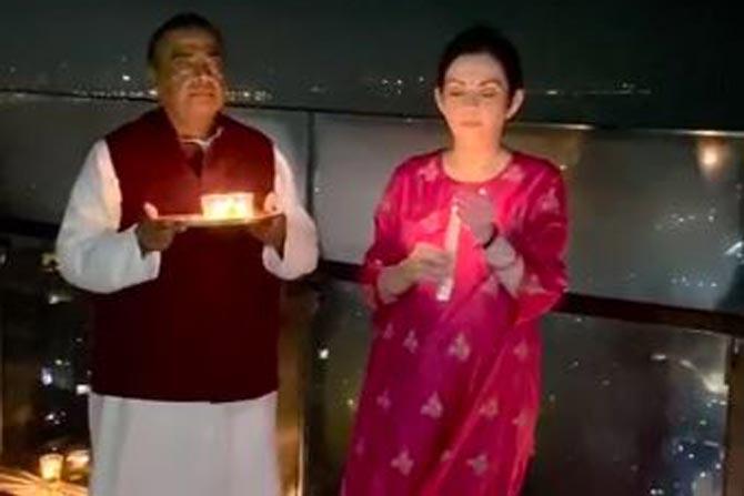 Reliance chairman and managing director Mukesh Ambani and his wife Nita Ambani on Sunday night also lit candles to mark India's resilience to fight against COVID-19.