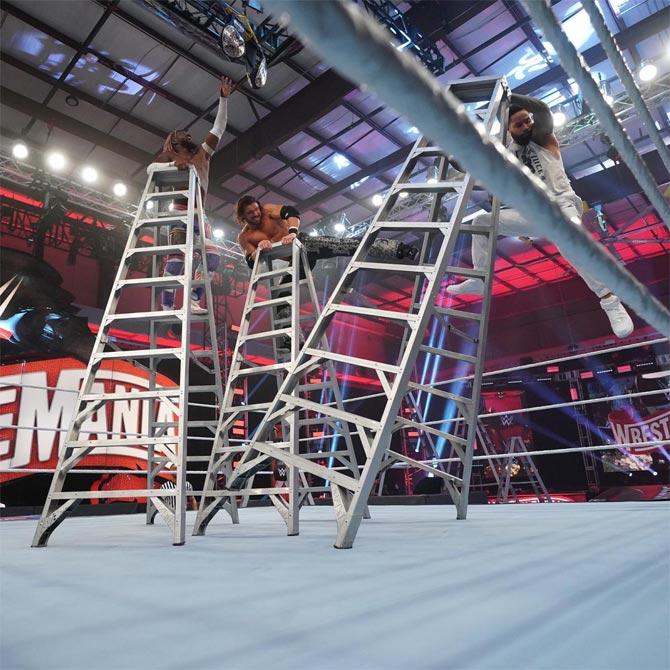 John Morrison defended the SmackDown tag team titles against Kofi Kingston and Jimmy Uso in a triple threat Ladder match.