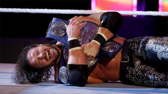 John Morrison, Kofi Kingston and Jimmy Uso would climb up the ladder and get a hold of the SD tag team titles. Kingston and Uso hit Morrison onto the ladder below but only to realise that Morrison held to the tag team titles while falling off, thus, retaining the titles.