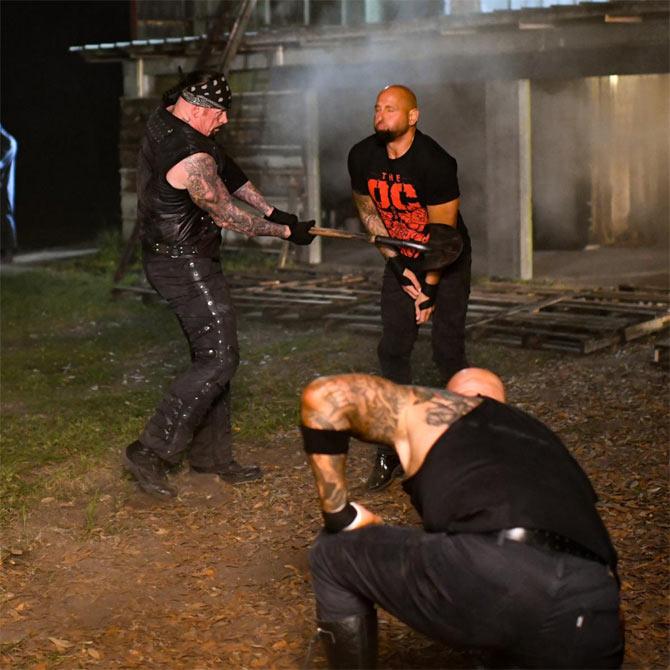 AJ Styles' O.C. partners Luke Gallows and Karl Anderson came to the aide of Styles along with a group of men in hoods but Undertaker was too good for them and levelled the game with a shovel