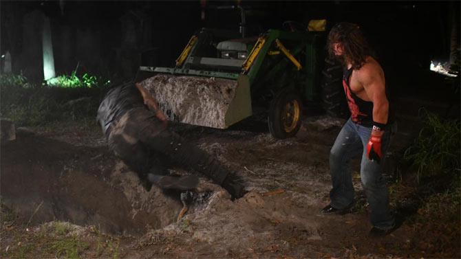 AJ Styles came from behind and attacked The Undertaker before humiliating him with words. Styles then pushed the Undertaker into the grave and was almost going to bury him.