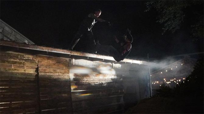 Undertaker surprised AJ Styles and showed up behind the truck before carrying him and hitting a Tombstone Piledriver atop the roof of the house. Undertaker then threw AJ Styles from the top of the roof.