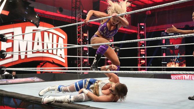 Another big match was Rhea Ripley defending the NXT title for the first time ever against Charlotte Flair at WrestleMania. While Rhea Ripley had youth on her side, the Queen Charlotte Flair has experience on hers.