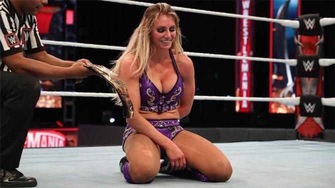 Charlotte Flair, who kicked out of Rhea Ripley's RipTide, put on the Figure Eight leglock to make Ripley tap out and win her second NXT women's title - history being made!