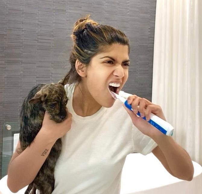 Ananya shared this photo where the Birla scion can be seen brushing her teeth with a pet dog in her hands. Ananya captioned this one: Stay hygienic and spread love!