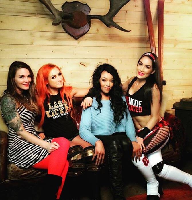 In picture: Lita with Becky Lynch, Alicia Fox and Brie Bella backstage