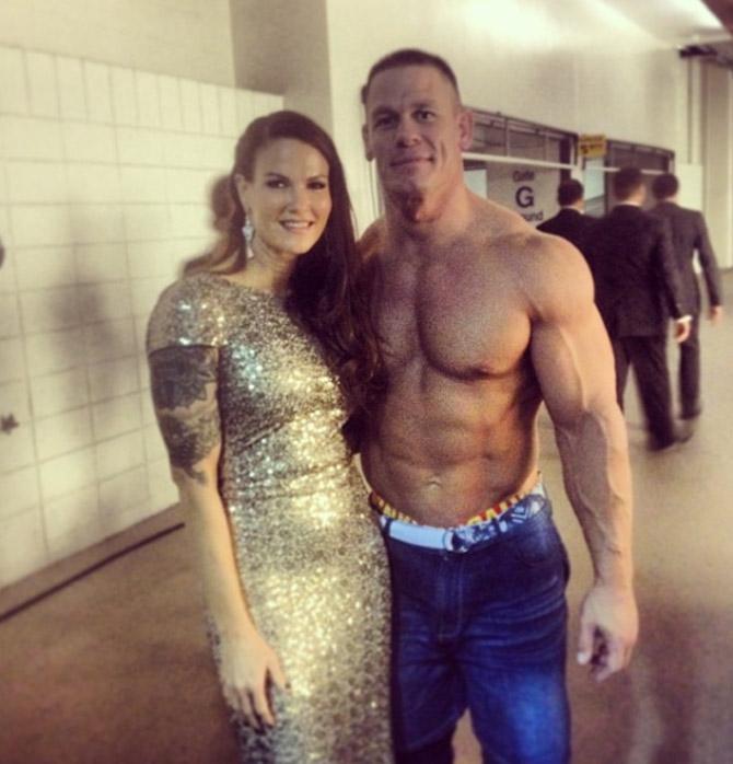 In picture: Lita with 16-time WWE champion John Cena 
