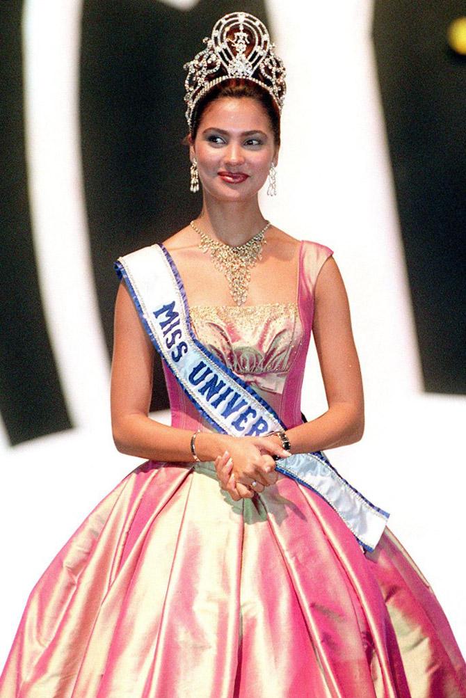 Miss Universe 2000, India's Lara Dutta dress in Thai silk pose for a photo on the catwalk during the fundraising fashion show for AIDS-patients - August 23, 2000. Dutta was on a weekly-long charity program to raise awareness on HIV-AIDS and other health issues.
