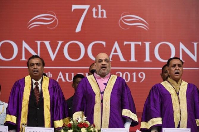 In picture: Home Minister Amit Shah (C), Chairman of Pandit Dindayal Petroleum University (PDPU) and businessman Mukesh Ambani (L) and Gujarat state Chief Minister Vijaybhai Rupani at the 7th Convocation Ceremony at the PDPU campus in Gandhinagar