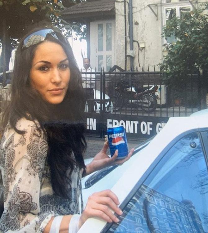 In picture: Nikki Bella's twin sister Brie Bella caught in a candid moment while entering her car in Mumbai.