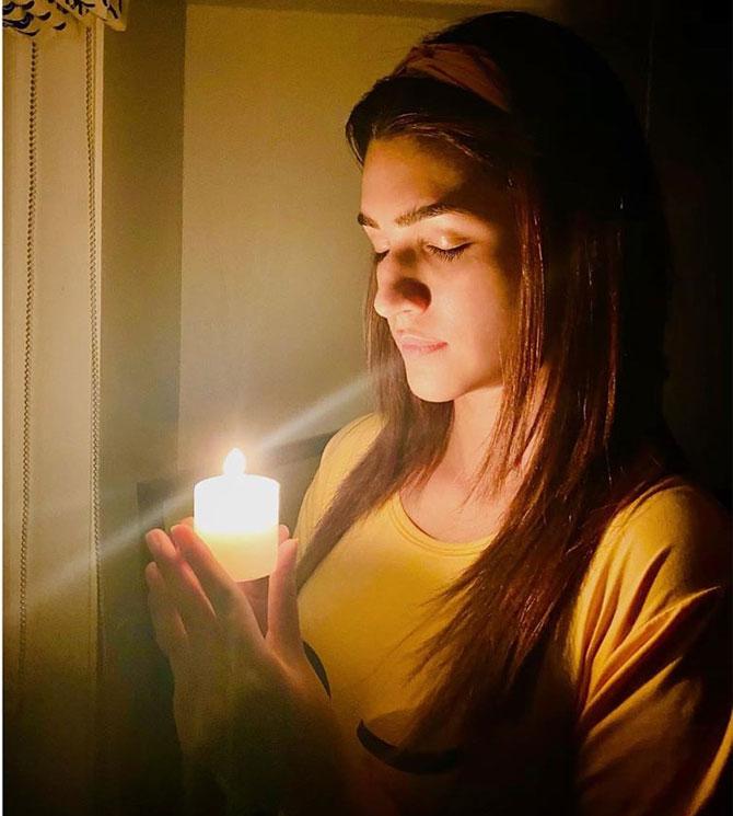 Kriti Sanon shared this photo of her with a candle in her handle to salute our COVID-19 heroes during #9pm9minutes. She wrote, 