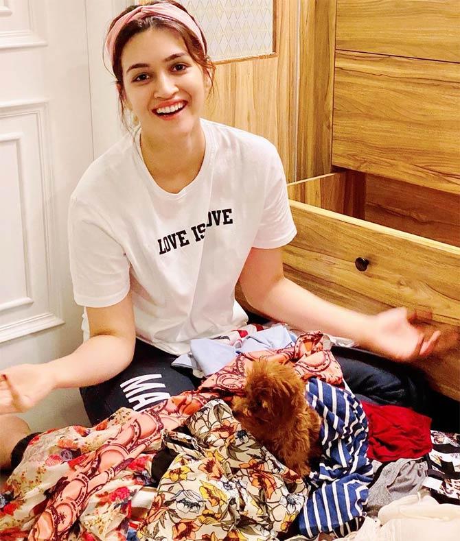 Kriti Sanon shared this adorable photo of her cleaning the wardrobe, but her dog Phoebe had some fun time with all those clothes lying around. Kriti wrote, 