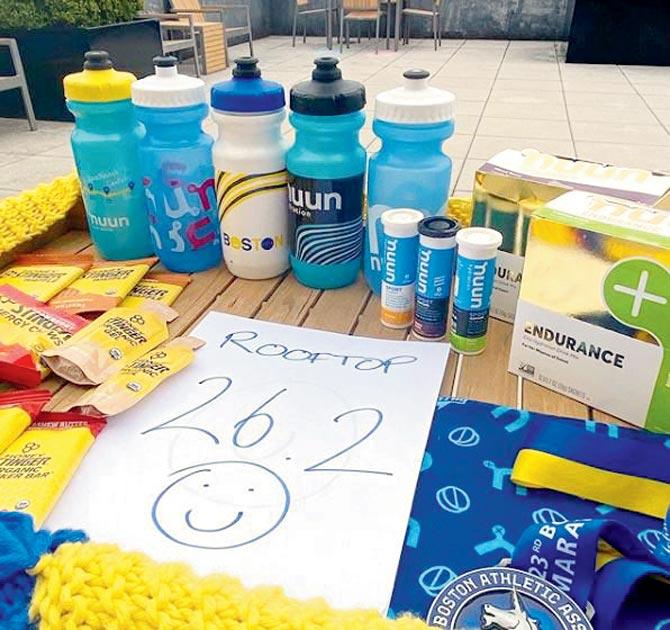 The aid station with water bottles and a finisher