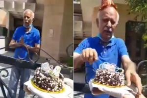 Senior citizen gets emotional as police surprise him with birthday cake