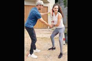 Brazilian model Coco gets batting tips from her coach boyfriend
