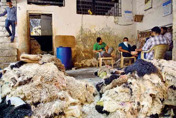 Leather unit workers sit amid mounds of unprocessed leather piled up due to the lockdown. PICS/SHADAB KHAN