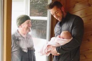 Grandfather walks 6km to see newborn grand-daughter through window