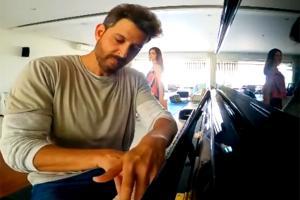 Hrithik Roshan posts a video playing piano; Sussanne Khan photobombs
