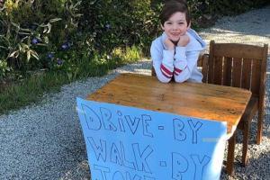 COVID-19: Six-year-old boy's drive-by, walk-by joke stand wins hearts