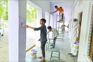 Coronavirus: Migrant workers paint school walls to thank locals