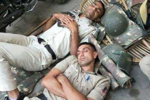 Coronavirus: Viral photo of cops sleeping on ground wins hearts!