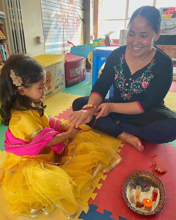 Inaaya Naumi Kemmu with her Nanny - Shobha Didi: This picture stole our heart! Soha Ali Khan shared this picture of her little one tying Rakhi to her Nanny. 