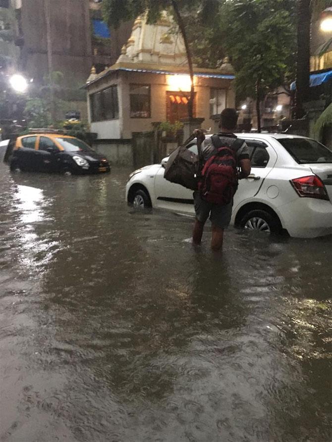 Mumbai and its surrounding areas received extremely heavy rainfall throughout the night on Monday and it continued on Tuesday, leading to flooding in many areas and traffic disruption across the city.