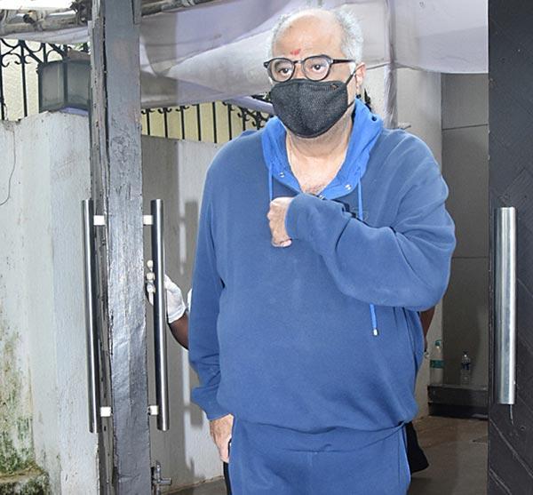 Boney Kapoor along with his family went to his mother's home for Rakhi celebrations in Lokhandwala, Andheri. The filmmaker sported his usual blue track suit with an addition of a protective face mask. All pictures/Yogen Shah