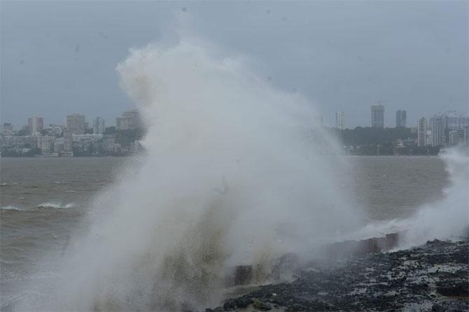 In photo: High tide hits the coastline of Mumbai at Marine Drive as heavy rains continue to lash the city.