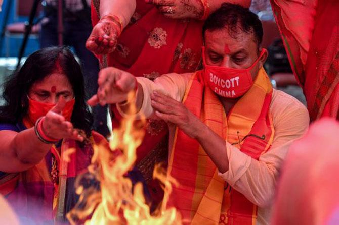 A VHP activist, at VHP headquarters in New Delhi, performs Hawan Puja (ritual) before the stone ceremony.
