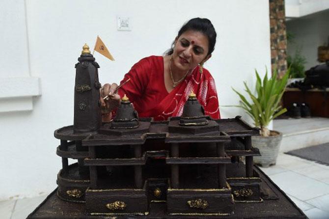 Shilpa Bhatt, a 40-year-old entrepreneur and manufacturer-supplier of chocolates from Ahmedabad, gives finishing touches to the model of Ram Mandir in Ayodhya. Shilpa made the Ayodhya Ram Mandir chocolate model using about 15 kg chocolates within 12 hours.