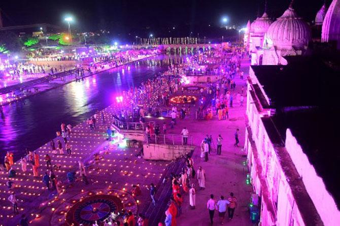 Devotees light earthen lamps on the banks of River Sarayu on the eve before the groundbreaking ceremony of 'bhoomi pujan'.