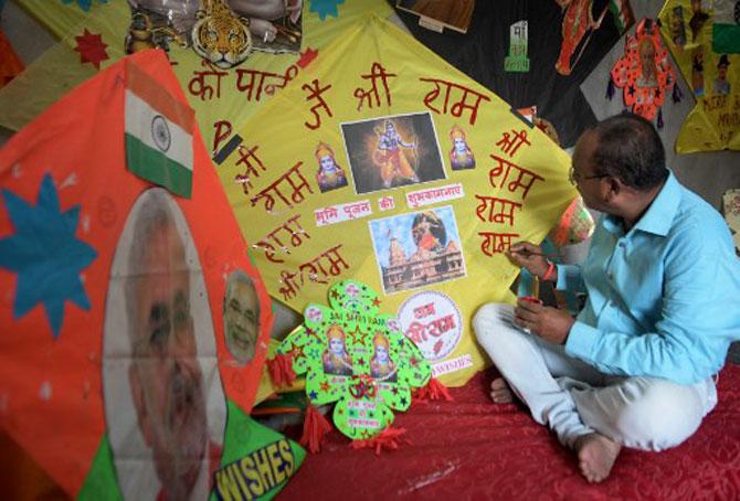 A kite-maker, from Amritsar, gives final touches to a kite decorated with pictures of Ram Mandir, Lord Ram Darbar, and Prime Minister Narendra Modi.