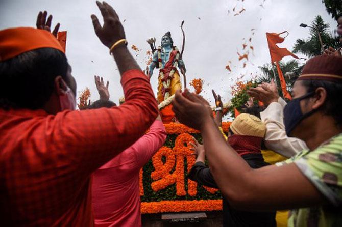People celebrate and dance around a 7-feet tall statue of Lord Ram in Pune.