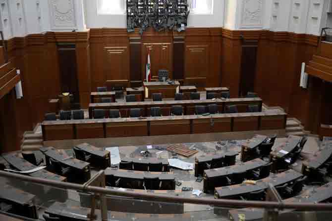 Meanwhile, protests have erupted in Beirut as thousands of people were pouring into the parliament and the city main square on Saturday, where they had set up symbolic nooses to hang politicians whose corruption and negligence they blame for the blast.
In picture: Debris litters the floor of the Lebanese Parliament hemicycle in the central district of Beirut.