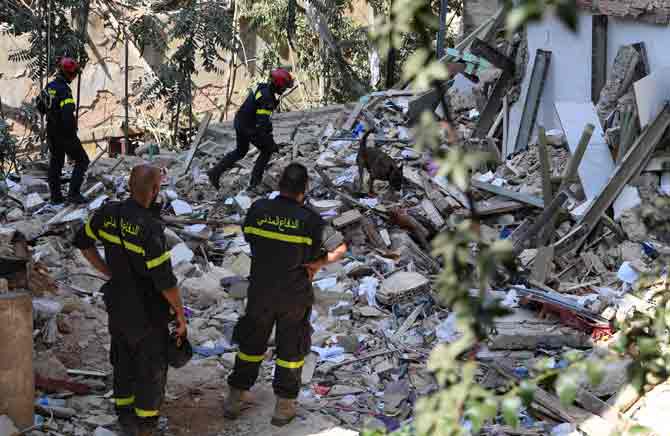 Dr. Rick Brennan, WHO's emergencies director for the eastern Mediterranean, expressed concerns that the coronavirus outbreak in Lebanon could now get worse in the aftermath of the blast.
In picture: Rescuers and civil defence search through the debris at Beirut port's silo.