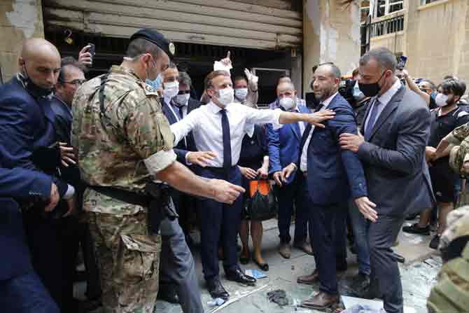 French President Emmanuel Macron arrived in Beirut on Thursday to express support for Lebanon. France and other countries have sent emergency aid and search-and-rescue teams.
In picture: French President Emmanuel Macron visits a devastated street of Beirut.