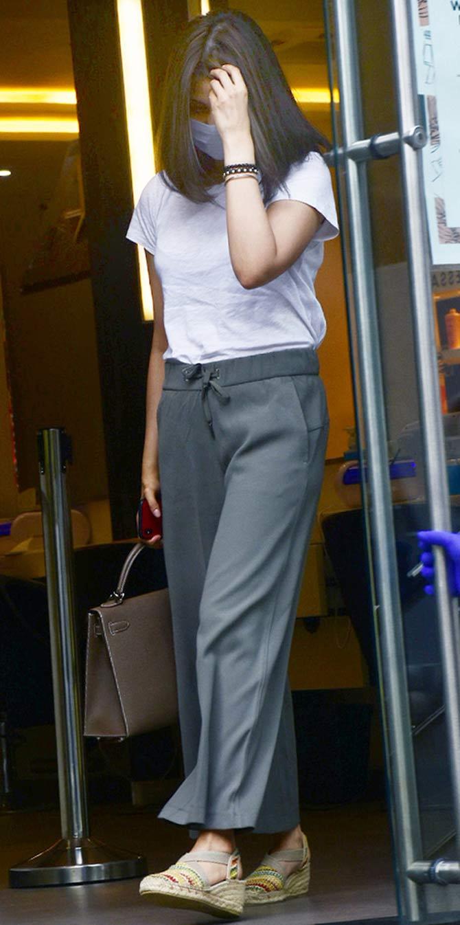 Riddhima Kapoor Sahni was spotted at a parlour in Mumbai. She was seen wearing a white tt paired with grey wide-legged pants in the city. All pictures/Yogen Shah and Pallav Paliwal