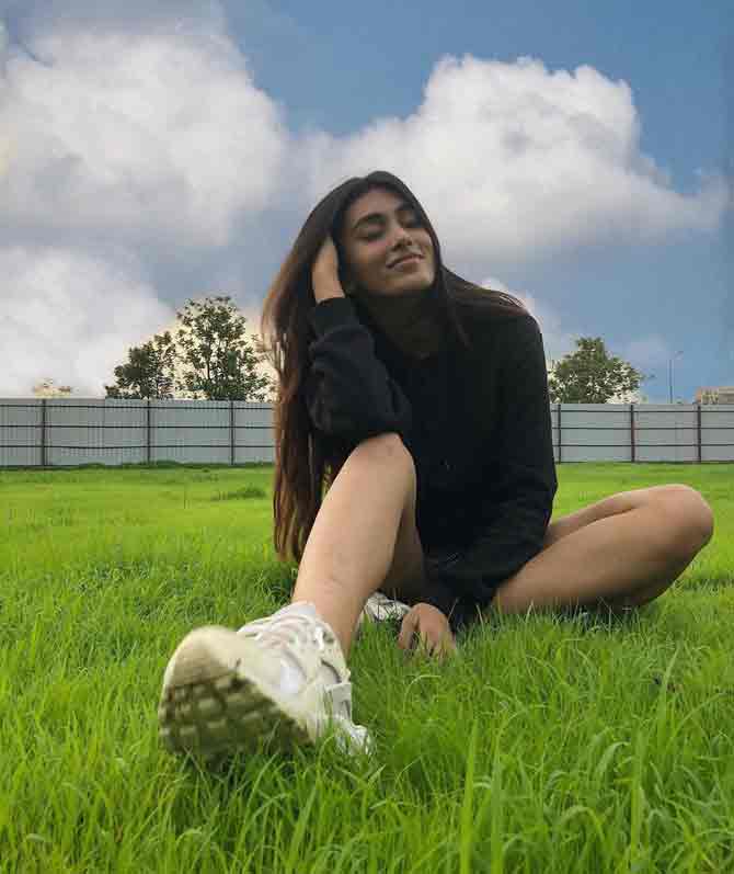 Andhale pulls off a successful attempt to blend in with nature and look stylish in this black tank top and a pair of hot pants teamed with a pair of sneakers.