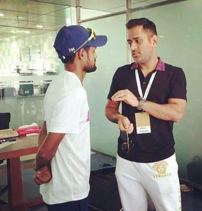 In picture: Shahbaz Nadeem listens intently as MS Dhoni shares some veteran tips